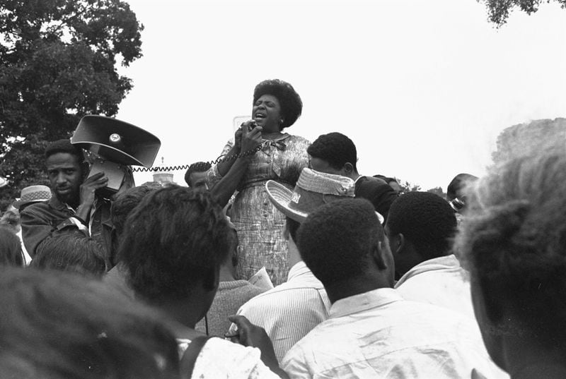 Fannie Lou Hamer speaks to Mississippi Freedom Democratic Party sympathizers outside the Capitol in Washington, Sept. 17, 1965, after the House of Representatives rejected a challenge to the 1964 election of five Mississippi representatives. Hamer and two other black women were seated on the floor of the House while the challenge was considered. The challengers claimed blacks were excluded from the election process in Mississippi.