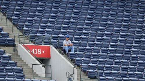 A solitary Braves fan has the entire 418 section to himself to watch the Braves play the Marlins in the finale of a three-game set Wednesday at Turner Field in Atlanta.