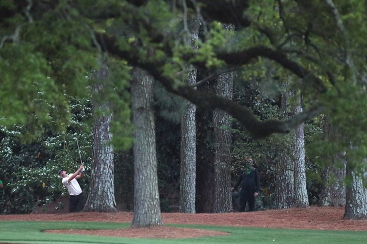 April 10, 2021, Augusta: Justin Rose hits his second shot out of the rough toward the eighteenth green during the third round of the Masters at Augusta National Golf Club on Saturday, April 10, 2021, in Augusta. Curtis Compton/ccompton@ajc.com