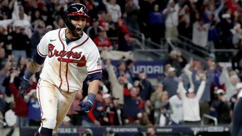 Braves leftfielder Eddie Rosario reacts after hitting the walk-off hit that scored shortstop Dansby Swanson in the ninth inning against the Los Angeles Dodgers in Game 2 of the NLCS Sunday, Oct. 17, 2021, at Truist Park in Atlanta. The Braves won 5-4 to take a 2-0 series lead. (Curtis Compton / curtis.compton@ajc.com)