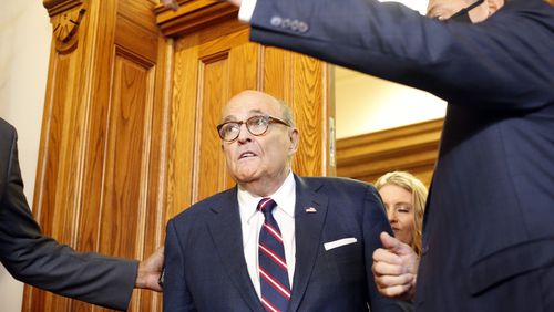 Rudy Giuliani walks to a Senate hearing at the Georgia State Capitol in Atlanta on Thursday, December 3, 2020. (Rebecca Wright for the Atlanta Journal-Constitution)