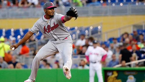 Julio Teheran delivers a pitch during the first inning of a baseball game against the Miami Marlins Saturday in Miami.