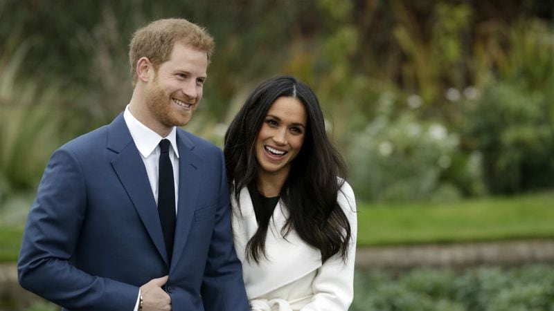 Britain's Prince Harry and his fiancee Meghan Markle pose for photographers during a photocall in the grounds of Kensington Palace in London, Monday Nov. 27, 2017. Britain's royal palace says Prince Harry and actress Meghan Markle are engaged and will marry in the spring of 2018. (AP Photo/Matt Dunham)