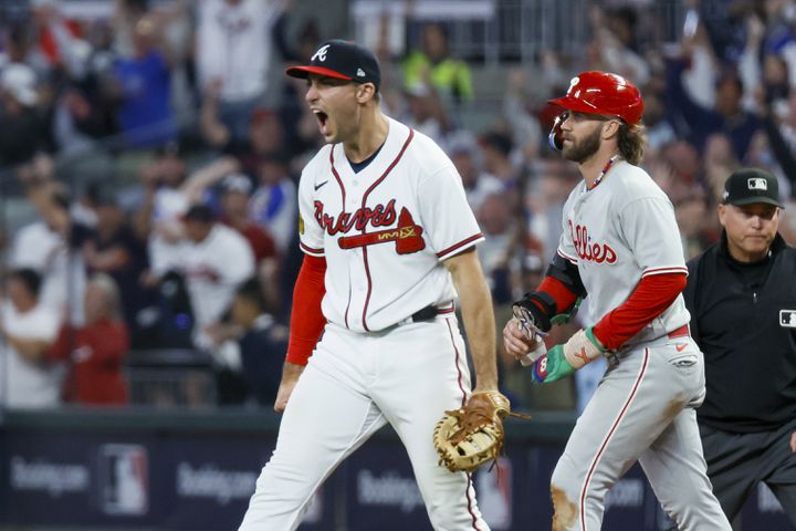 Atlanta Braves first baseman Matt Olson (28) reacts after forcing out Philadelphia Phillies’ Bryce Harper at first base on a fly out by Nick Castellanos to end the ninth inning of NLDS Game 2 in Atlanta on Monday, Oct. 9, 2023.   (Miguel Martinez / Miguel.Martinezjimenez@ajc.com)