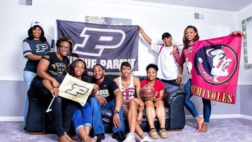 Photo of the Morgan-Gray family and their respective college affiliations. (Photo courtesy of Angel Gray)