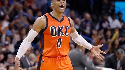 Oklahoma City Thunder guard Russell Westbrook (0) reacts after shooting a 3 point basket against the New Orleans Pelicans during the second half of an NBA basketball game in Oklahoma City, Sunday, Dec. 4, 2016. Oklahoma City won 101-92. (AP Photo/Alonzo Adams)