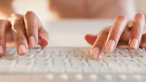 Woman typing on keyboard. (Blend Images - JGI/Jamie Grill / Brand X Pictures / Getty Images)