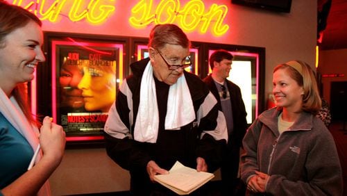 Larry Munson and his film club prepare to catch a showing of "Casino Royale" in 2006 in Athens. Munson, the legendary voice of the Georgia Bulldogs who died Sunday at the age of 89, hosted a movie club that met every Saturday and always for the first show.