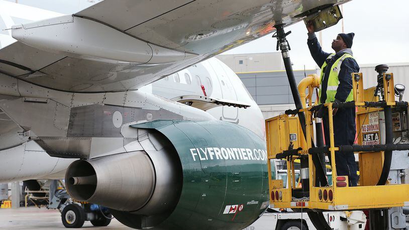 A Frontier Airlines plane is fueled before departing Hartsfield-Jackson International Airport in 2016.