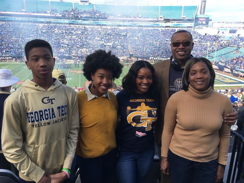 Matthew Cleveland (left) is a Florida State basketball player in the 2021-22 season, but his parents are graduates of Georgia Tech. Matthew is shown here at the 2016 TaxSlayer Bowl in Jacksonville, Fla., that featured Tech and Kentucky. He's with his family: (L-R) sisters Alyssa and Bryana, his dad, Ralph, and his mother, Sandra. (Contributed by Cleveland family.)
