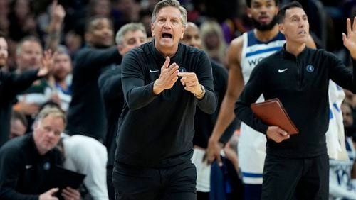 Minnesota Timberwolves head coach hChris Finch calls times out during the second half of Game 3 of an NBA basketball first-round playoff series against the Phoenix Suns, Friday, April 26, 2024, in Phoenix. (AP Photo/Matt York)