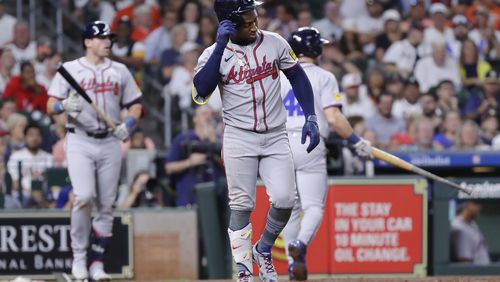 Ozzie Albies limps to first base after getting hit by a pitch in the foot during the second inning of Monday's game against the Astros in Houston. (AP Photo/Michael Wyke)