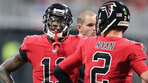 Falcons Julio Jones and Matt Ryan confer during the second half against the Saints in a NFL football game on Thursday, December 7, 2017, in Atlanta.  Curtis Compton/ccompton@ajc.com