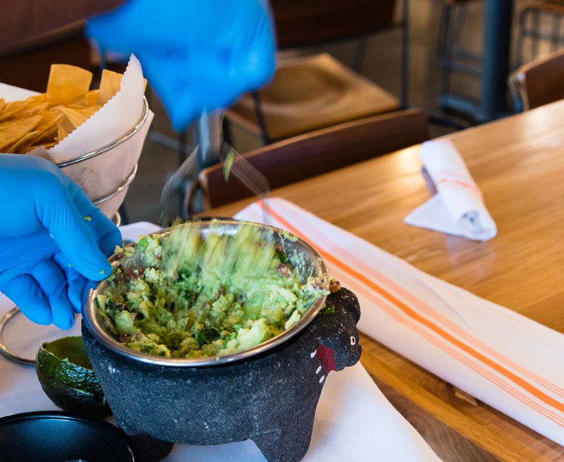 Tableside guacamole is a specialty at Babalu. CONTRIBUTED BY HENRI HOLLIS