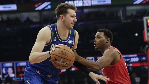 Luka Doncic of the Dallas Mavericks drives past Kyle Lowry of the Toronto Raptors during the first half of the NBA All-Star basketball game Sunday, Feb. 16, 2020, in Chicago. (AP Photo/Nam Huh)