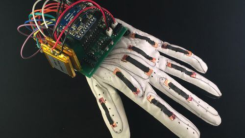 Glove reads the American Sign Language alphabet and transmits the letters wirelessly to an app on a phone or computer. (Timothy O’Connor/UC San Diego Jacobs School of Engineering)