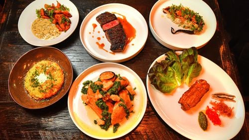 Offerings from Cattle Shed Wine & Steak Bar in Forsyth’s Halcyon mixed-use development include (from top left) Ember Roasted Vegetables (carrots), NY Strip, Grilled Octopus, (from bottom left) Pomme Rosti, Roasted Half Chicken, and Barbeque Lamb Belly. Chris Hunt for The AJC