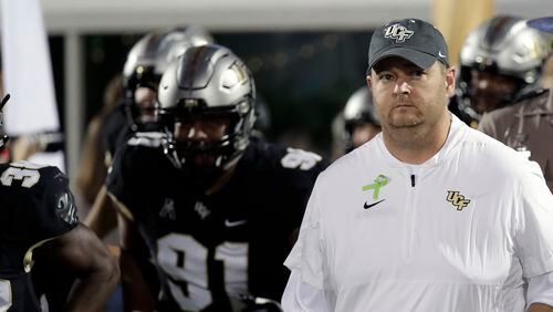 Central Florida head coach Josh Heupel takes the field with his players before the first half of a game against East Carolina Saturday, Oct. 19, 2019, in Orlando, Fla.