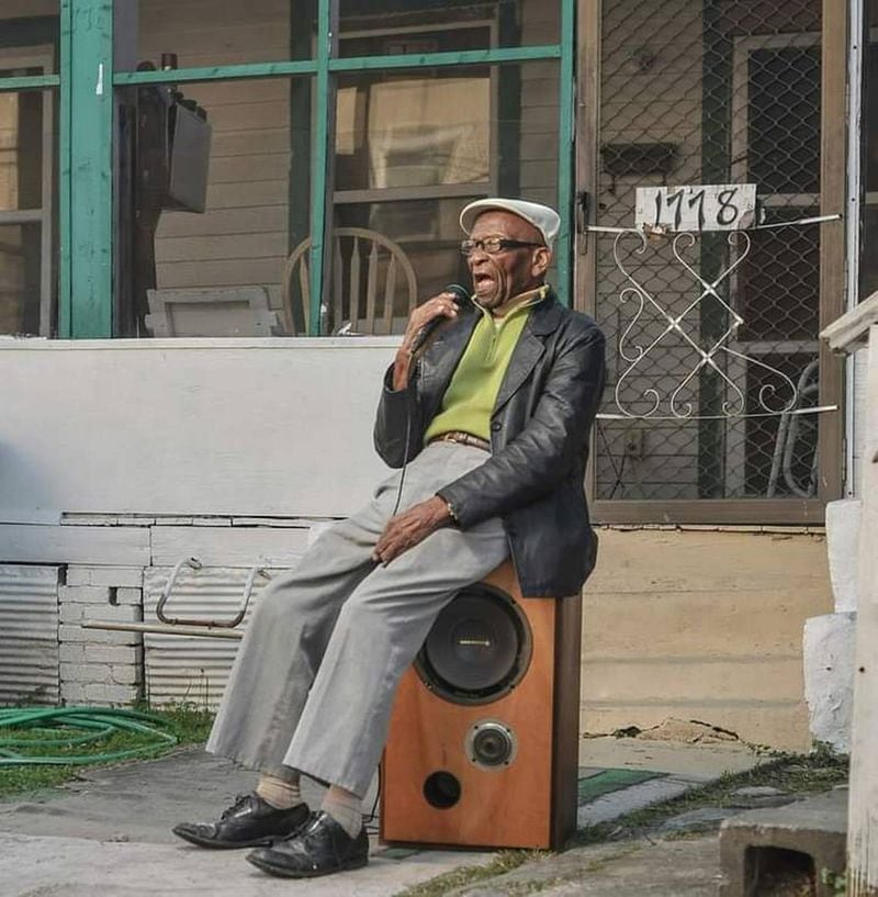Buddy Barron sings while sitting on a speaker as part of the Macon Music Project, a photography documentary started by his grandson Dsto Moore. (Photo Courtesy Dsto Moore)
