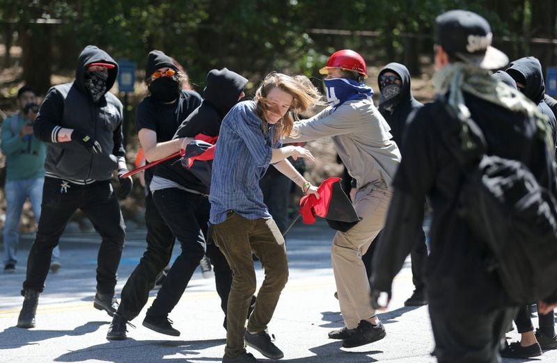 Counter-protesters fight among themselves at Stone Mountain Park on Saturday afternoon April 23, 2016. Hundreds of counter-demonstrators turned out to oppose a white power protest at the park. BEN GRAY / AJC