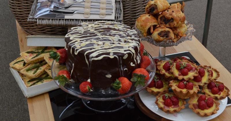 This 2016  “Great British Baking Show” showstopper, baked by Candice Brown, required contestants to make a picnic fit for the queen, complete with cake, sausage rolls, scones, mini quiches and custard and fruit tarts. (Courtesy of BBC)