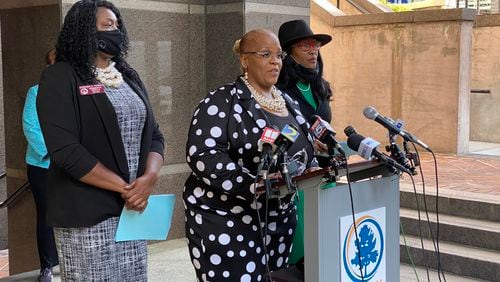 Fulton County Commissioner Khadijah Abdur-Rahman speaks outside 141 Pryor St. in downtown Atlanta about her resolution against SB 202. (Ben Brasch/AJC)