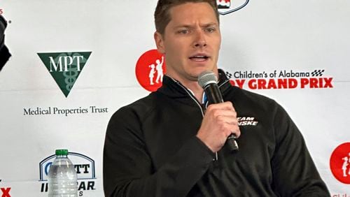Reigning Indianapolis 500 champion Josef Newgarden talks in Birmingham, Ala., Friday, April 26, 2024, about his recent disqualification in the season-opening IndyCar auto race. Newgarden is preparing for Sunday's race at Birmingham's Barber Motorsports Park. (AP Photo/John Zenor)
