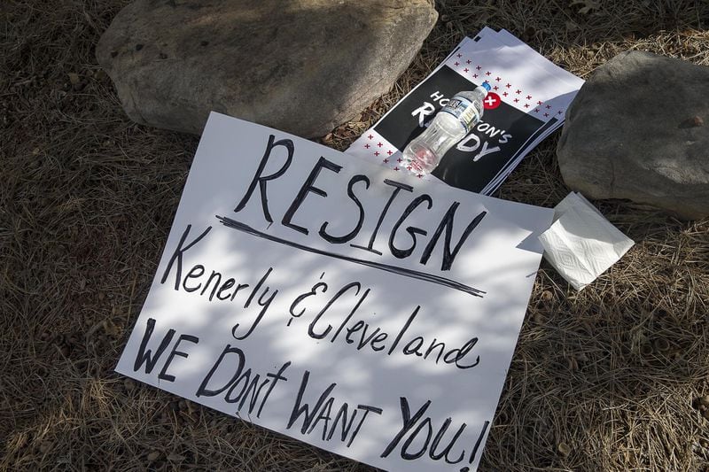 A sign demanding the resignation of Hoschton Mayor Theresa Kenerly and City Council Member Jim Cleveland sits near the city hall building in Hoschton, Monday, May 6, 2019. (ALYSSA POINTER/ALYSSA.POINTER@AJC.COM)