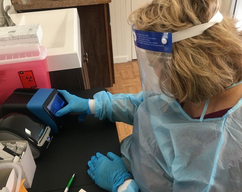 A staff member at PruittHealth – Augusta Hills nursing home runs a rapid coronavirus test at the center. It’s part of the company’s effort to improve testing and meet new federal testing requirements. (submitted)