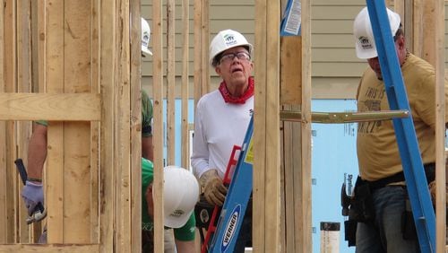 Former President Jimmy Carter, center, works on a Habitat for Humanity construction project in Memphis, Tenn. (AP Photo/Adrian Sainz)