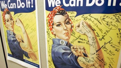 File - In this Oct. 31, 2007 file photo, a poster showing signatures of former Rosie the Riveter's is seen at the offices of the Rosie the Riveter/World War II Home Front National Historic Park in Richmond, Calif. A woman identified by a scholar as the inspiration for Rosie the Riveter, the iconic female World War II factory worker, has died in Washington state. The New York Times reports that Naomi Parker Fraley died Saturday, Jan. 20, 2018, in Longview. She was 96. Multiple women have been identified over the years as possible models for Rosie, but a Seton Hall University professor in 2016 focused on Fraley as the true inspiration. (AP Photo/Eric Risberg, File)