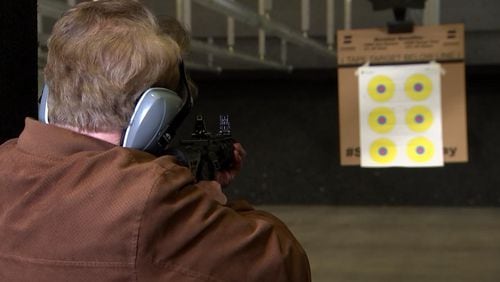 Channel 2 Action News reporter Tom Regan fires the finished AR-15 at a local gun range.