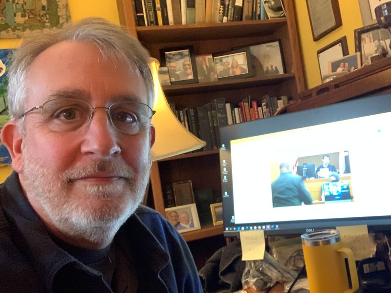 Reporter Bill Rankin works from home covering a hearing to make public a special purpose grand jury’s report on whether former President Donald Trump and his allies violated Georgia law after the 2020 election.
