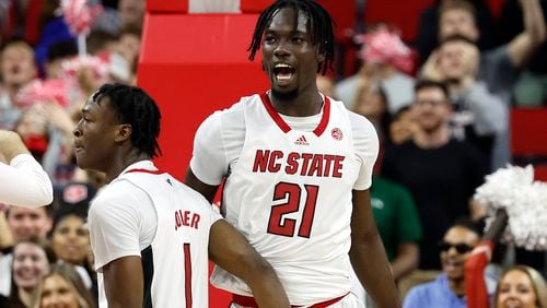 North Carolina State's Ebenezer Dowuona (21) celebrates a basket against Duke during the first half of an NCAA college basketball game in Raleigh, N.C., Wednesday, Jan. 4, 2023. (AP Photo/Karl B DeBlaker)