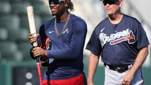 Braves manager Brian Snitker looks on while Ronald Acuna Jr. takes batting practice in CoolToday Park at spring training on Saturday, Feb. 15, 2020, in North Port.  Curtis Compton ccompton@ajc.com