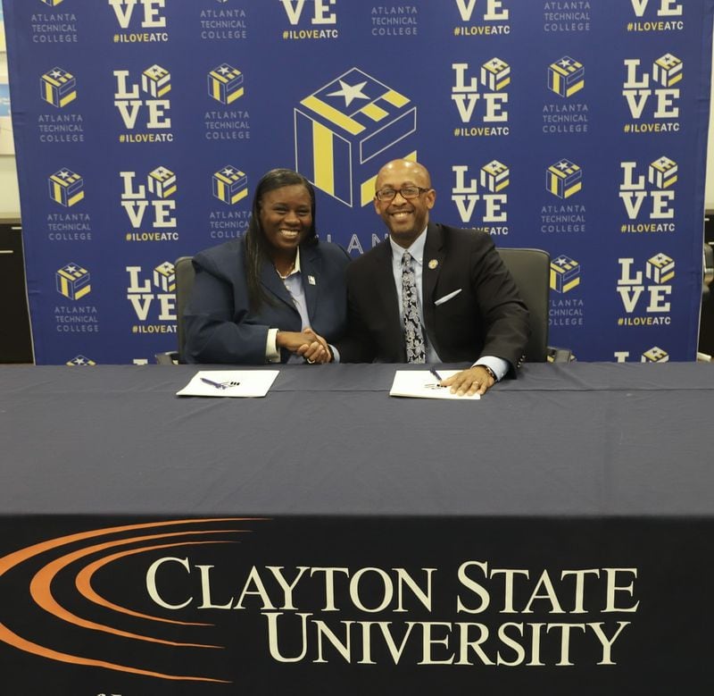 Atlanta Technical College President Victoria Seals and Clayton State University President Georj Lewis sign an articulation agreement on Friday, March 22, 2024. The agreement is aimed at making it easier for students to transfer. (Courtesy of Atlanta Technical College)