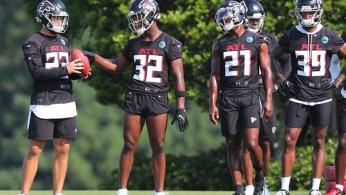 072921 Flowery Branch: Atlanta Falcons safeties Erik Harris (from left), Jaylinn Hawkins, Duron Harmon and T.J. Green prepare to run defensive drills during the first day of training camp practice at the team training facility on Thursday, July 29, 2021, in Flowery Branch.   “Curtis Compton / Curtis.Compton@ajc.com”
