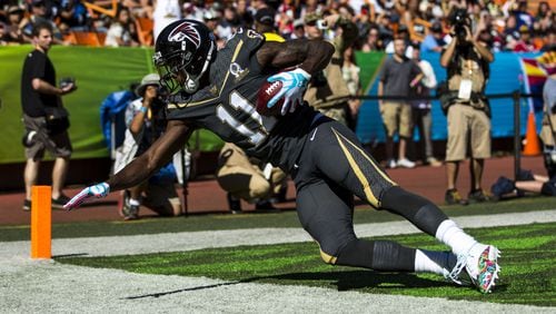 HONOLULU, HI - SUNDAY, JANUARY 31: Team Irvin wide receiver Julio Jones #11 of the Atlanta Falcons dives after catching a touchdown pass from quarterback Russell Wilson of the Seattle Seahawks during the first half of the 2016 NFL Pro Bowl at Aloha Stadium on January 31, 2016 in Honolulu, Hawaii. (Photo by Kent Nishimura/Getty Images)
