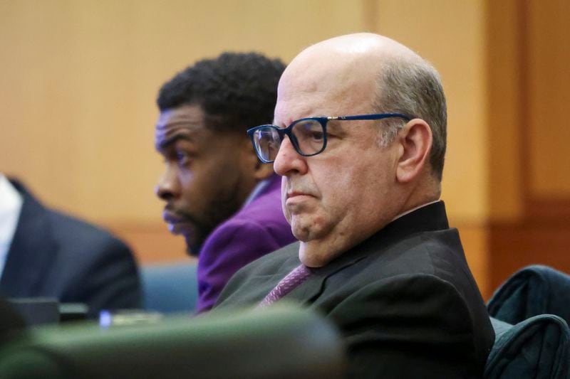 Defense attorney Doug Weinstein, center, sits next to the defendant Deamonte Kendrick he’s representing at the courtroom of Judge Ural Glanville at the Fulton County Courthouse, Friday, March 22, 2024, in Atlanta. (Jason Getz / jason.getz@ajc.com)
