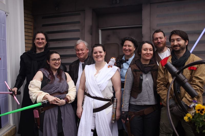 Members of the Wert family pose outside their Virginia Highland home at a "Star Wars"-themed party, hosted in anticipation of the release of "The Rise of Skywalker." CONTRIBUTED: MOLLY PRATT