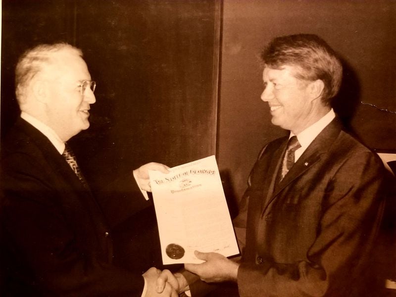 John S. Correll Sr. receiving a proclamation from the State of Georgia from then-Governor Carter.