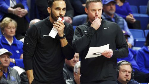 Georgia coach Mike White (R) and assistant Erik Pastrana have been making some strong moves on the recruiting trail, signing three players in the last week to give the Bulldogs five new players to add to the 2023-24 team. (AP Photo/James Crisp)