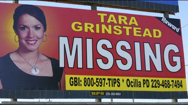 In this Wednesday, Oct. 4, 2006, file photo, missing teacher Tara Grinstead is displayed on a billboard in Ocilla, Ga. (AP Photo/Elliott Minor, File)
