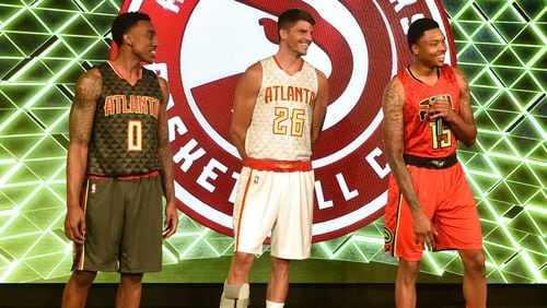 The Atlanta Hawks unveiled their new uniforms earliers this summer. Road uniform on the left, home uniform in the center, alternate road uniform on the right. BRANT SANDERLIN/BSANDERLIN@AJC.COM