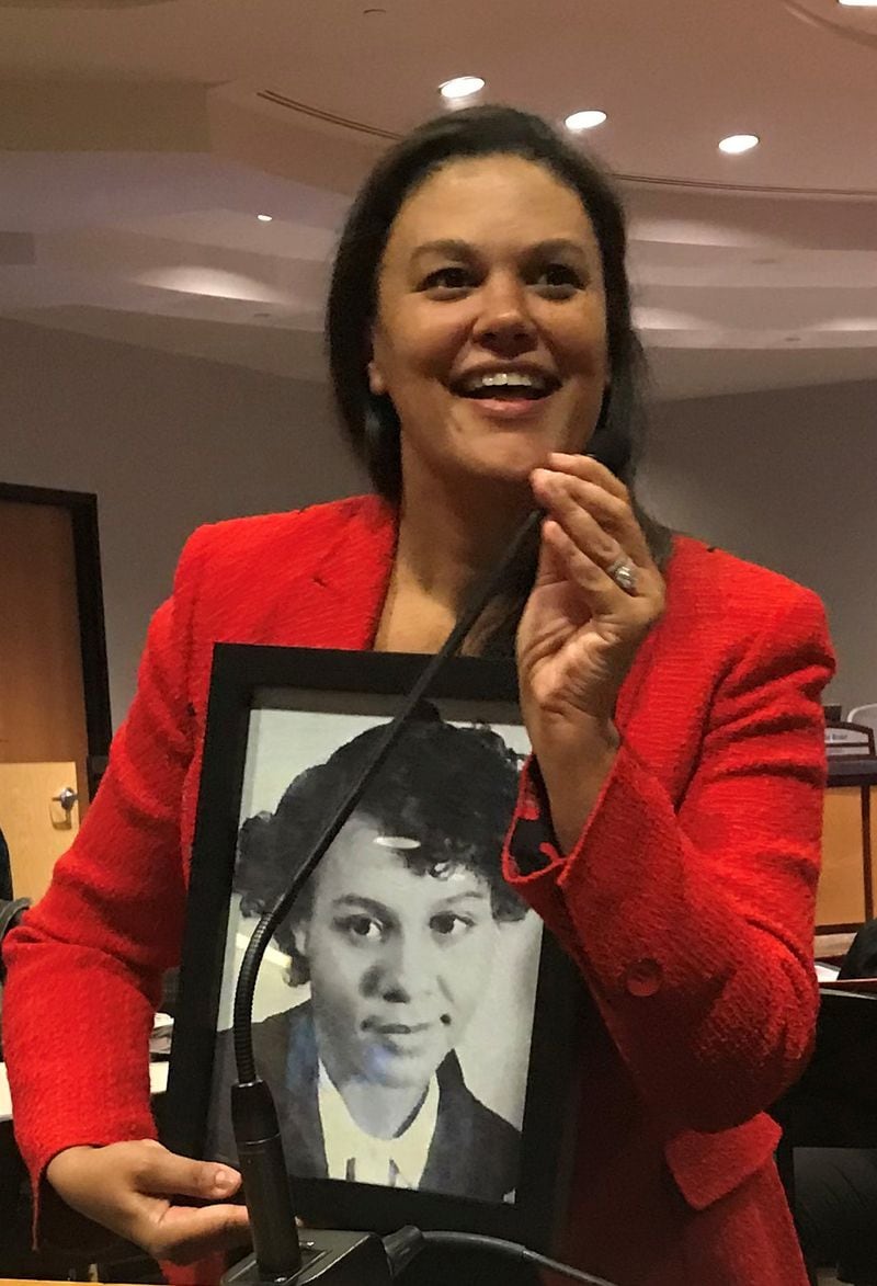 Atlanta Public Schools Superintendent Meria Carstarphen presents Mary Frances Early with a photo of Early from her younger years.