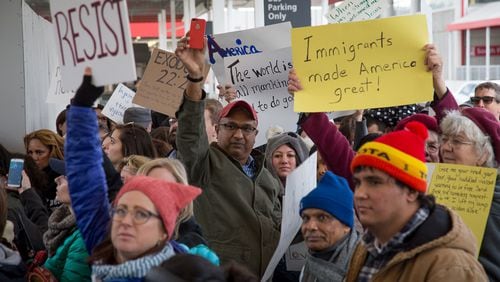 Protesters chant and hold up signs showing their opposition to President Trump’s travel ban at Hartsfield-Jackson Atlanta International Airport January 30, 2017 STEVE SCHAEFER / SPECIAL TO THE AJC