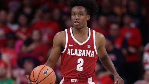TUCSON, AZ - DECEMBER 09:  Collin Sexton #2 of the Alabama Crimson Tide handles the ball during the first half of the college basketball game against the Arizona Wildcats at McKale Center on December 9, 2017 in Tucson, Arizona. The Wildcats defeated the Crimson Tide 88-82.  (Photo by Christian Petersen/Getty Images)