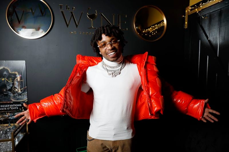 R&B singer Jacquees poses for a photograph at The Wine and Papas Lounge, which he co-owns with Voneka Marks. The restaurant opened its doors a month ago and is located in Stonecrest. Miguel Martinez / miguel.martinezjimenez@ajc.com