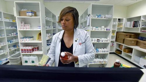Pharmacist Bridget McCord prepares prescriptions at Grady Memorial Hospital. It provides prescriptions for $5 or less to thousands of outpatients who are low-income or do not have insurance.