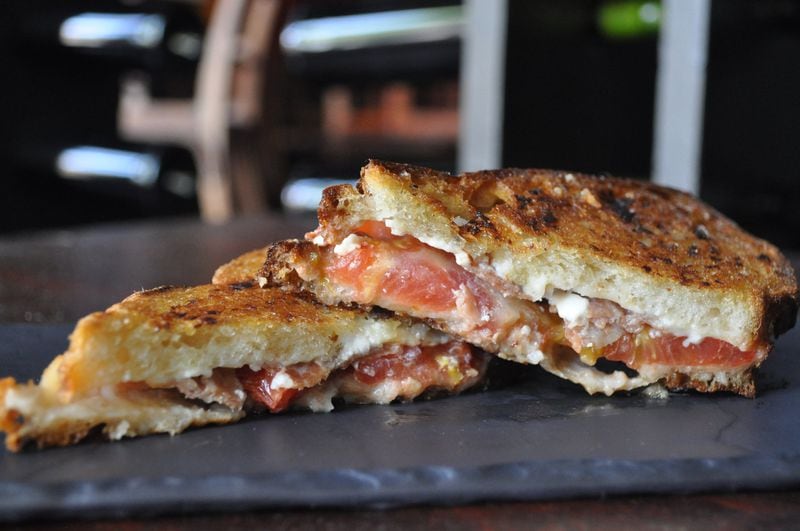 Iberian Pig is one of numerous area restaurants that will have a presence at Mercedes-Benz Stadium. Its two concession stands, both located on the 200-level concourse, will offer a serrano ham sandwich (shown here), pork cheek tacos, and a bacon-wrapped beef dog topped with manchego cheese sauce, crispy onions and a red pepper aioli. CONTRIBUTED BY IBERIAN PIG